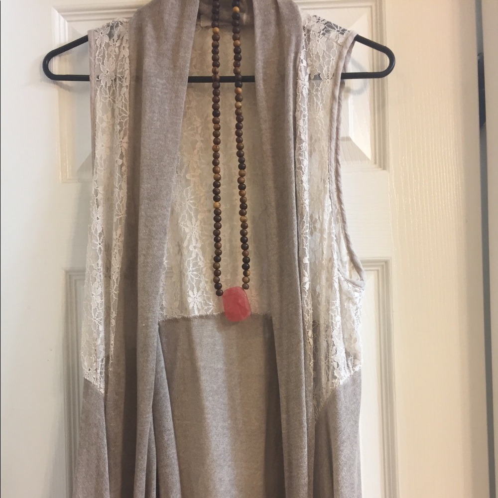 Lace vest worn over tunics